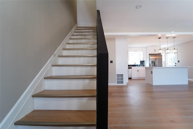 280 Neptune Ave, West Babylon, NY 11704 - stairway with wood finished floors and baseboards