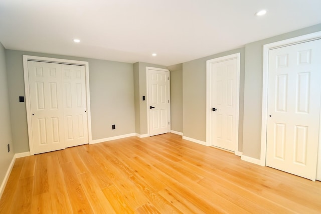 280 Neptune Ave, West Babylon, NY 11704 - unfurnished bedroom with light wood-type flooring and recessed lighting