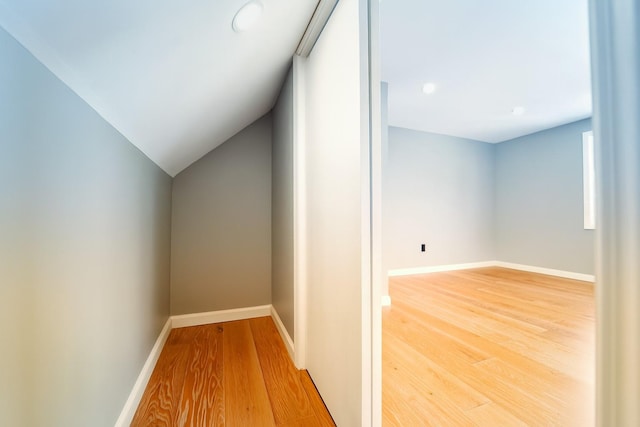 280 Neptune Ave, West Babylon, NY 11704 - bonus room featuring light wood-type flooring, lofted ceiling, and recessed lighting