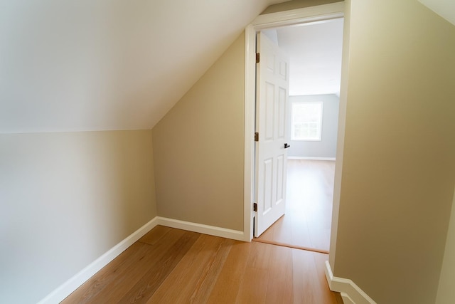 280 Neptune Ave, West Babylon, NY 11704 - additional living space featuring light wood-style floors and vaulted ceiling