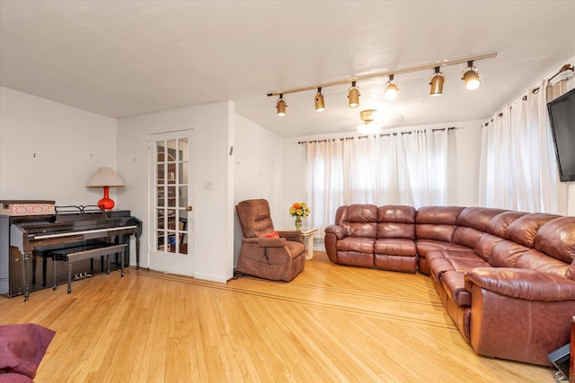 48 Carstairs Rd, Valley Stream, NY 11581 - living room with hardwood / wood-style floors and rail lighting