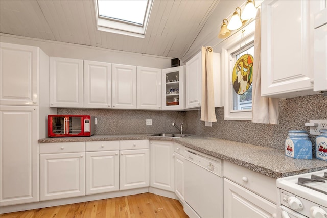 48 Carstairs Rd, Valley Stream, NY 11581 - kitchen featuring dishwasher, backsplash, white cabinetry, light countertops, and wooden ceiling