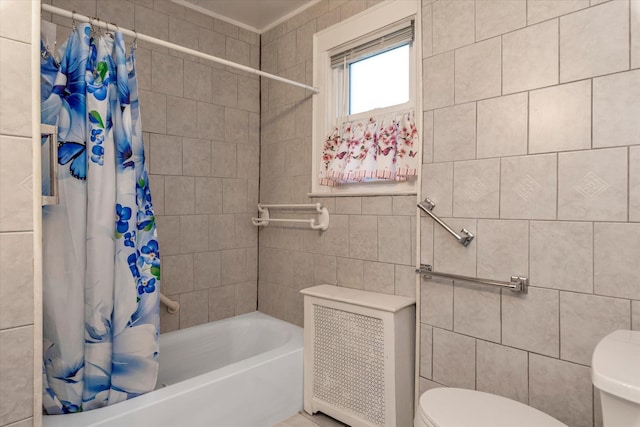48 Carstairs Rd, Valley Stream, NY 11581 - bathroom featuring tile walls, shower / bath combo, and radiator heating unit