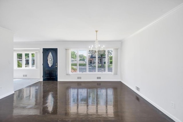 32 Clarkson Rd, Centereach, NY 11720 - foyer entrance with crown molding, a chandelier, and wood finished floors