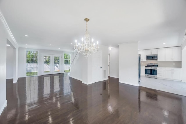 32 Clarkson Rd, Centereach, NY 11720 - unfurnished living room featuring wood finished floors, a chandelier, french doors, recessed lighting, and crown molding