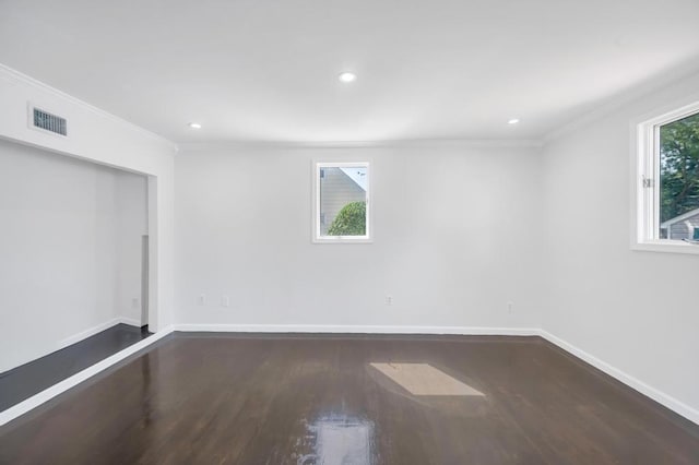 32 Clarkson Rd, Centereach, NY 11720 - spare room with crown molding, dark wood finished floors, and recessed lighting