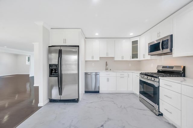 32 Clarkson Rd, Centereach, NY 11720 - kitchen with appliances with stainless steel finishes, light marble finish flooring, recessed lighting, glass insert cabinets, and white cabinets
