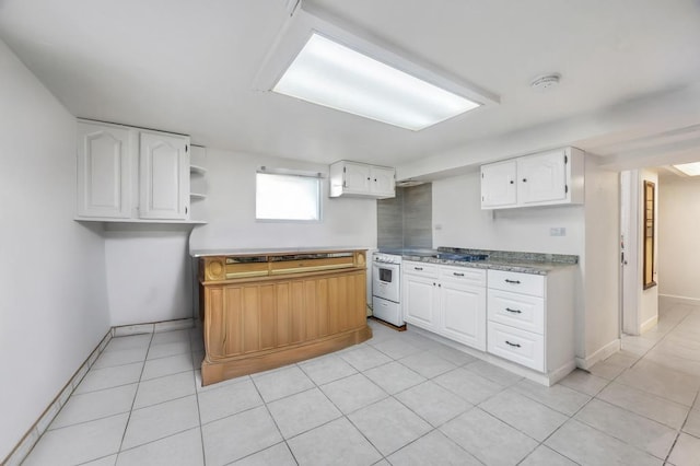 32 Clarkson Rd, Centereach, NY 11720 - kitchen featuring white cabinets, light tile patterned floors, light countertops, and open shelves