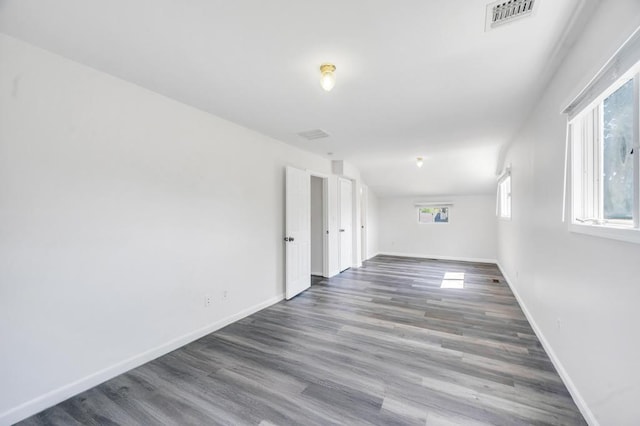 32 Clarkson Rd, Centereach, NY 11720 - empty room with baseboards and wood finished floors