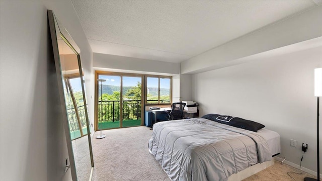 1020 Warburton Ave Unit 9C, Yonkers, NY 10701 - carpeted bedroom featuring access to outside and a textured ceiling