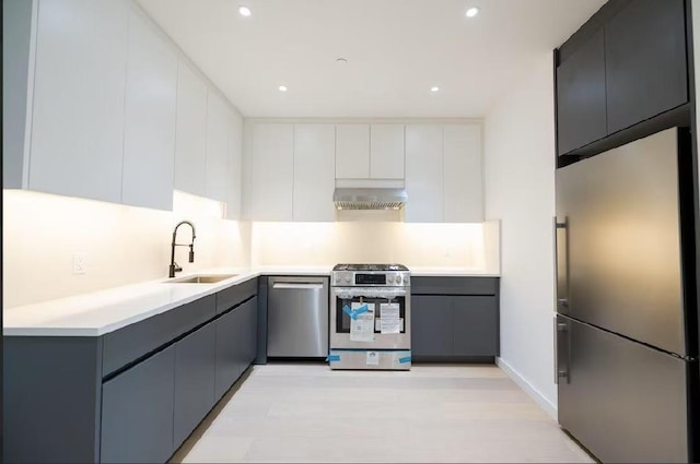 108-15 72nd Ave Unit 2C, Forest Hills, NY 11375 - kitchen featuring stainless steel appliances, range hood, recessed lighting, light countertops, and modern cabinets