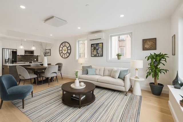 226 Hart St Unit 3B, Brooklyn, NY 11206 - living area with a wall mounted air conditioner, light wood-style flooring, and recessed lighting