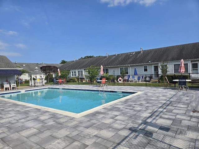 5 Primrose Ln, North Babylon, NY 11703 - community pool featuring a patio