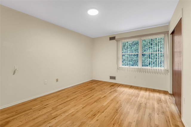5 Primrose Ln, North Babylon, NY 11703 - spare room featuring light wood-type flooring and baseboards