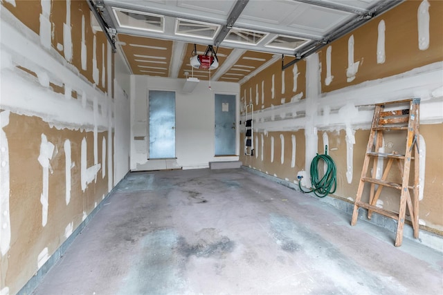 5 Primrose Ln, North Babylon, NY 11703 - garage featuring a garage door opener