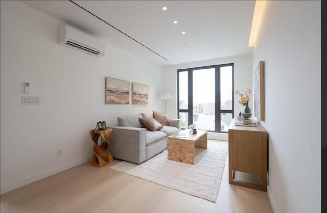 108-15 72nd Ave Unit 6A, Forest Hills, NY 11375 - living room featuring a wall mounted air conditioner, light wood-style flooring, and recessed lighting
