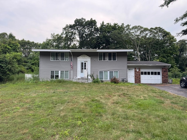 12 Deer Ln, East Setauket, NY 11733 - split foyer home featuring an attached garage, driveway, a front lawn, and entry steps