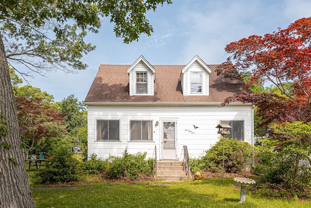 353 W Elm Rd, Mastic Beach, NY 11951 - cape cod house featuring a front lawn and roof with shingles