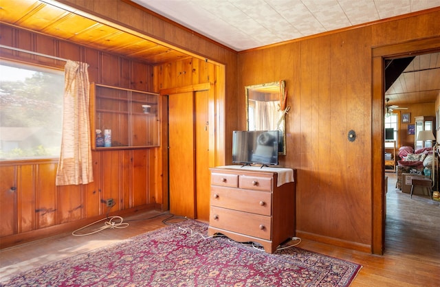 353 W Elm Rd, Mastic Beach, NY 11951 - bedroom featuring wooden walls and wood finished floors