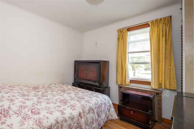 353 W Elm Rd, Mastic Beach, NY 11951 - bedroom with crown molding and wood finished floors