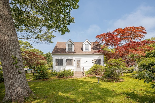353 W Elm Rd, Mastic Beach, NY 11951 - cape cod-style house with a front yard and a shingled roof