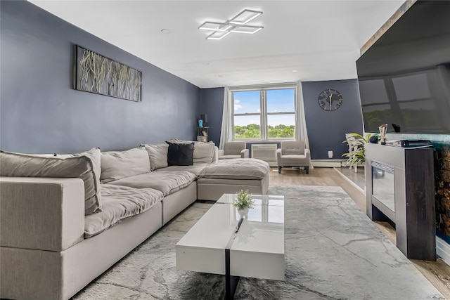 5444 Little Neck Pkwy Unit 6C, Little Neck, NY 11362 - living area with light wood-style floors and a baseboard radiator