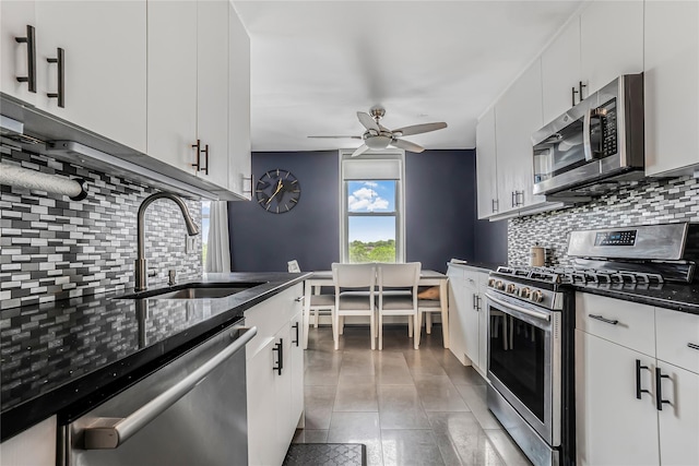 5444 Little Neck Pkwy Unit 6C, Little Neck, NY 11362 - kitchen featuring stainless steel appliances, tasteful backsplash, a ceiling fan, and white cabinets