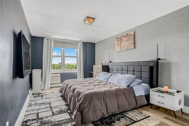 5444 Little Neck Pkwy Unit 6C, Little Neck, NY 11362 - bedroom with wood finished floors and baseboard heating