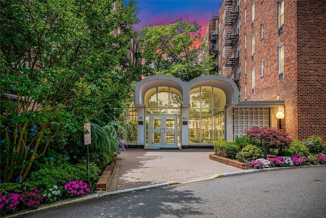 5444 Little Neck Pkwy Unit 6C, Little Neck, NY 11362 - view of exterior entry with french doors and brick siding