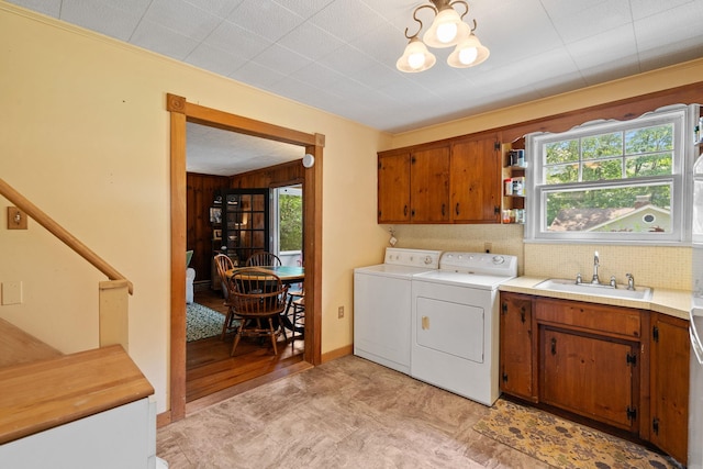 1467 Rte 292, Holmes, NY 12531 - laundry area featuring cabinet space, washer and dryer, and a chandelier