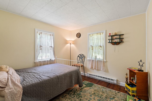 1467 Rte 292, Holmes, NY 12531 - bedroom featuring baseboard heating, multiple windows, and wood finished floors