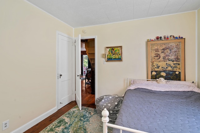 1467 Rte 292, Holmes, NY 12531 - bedroom featuring dark wood-type flooring and crown molding