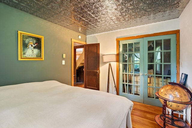 1467 Rte 292, Holmes, NY 12531 - bedroom with an ornate ceiling, french doors, and wood finished floors