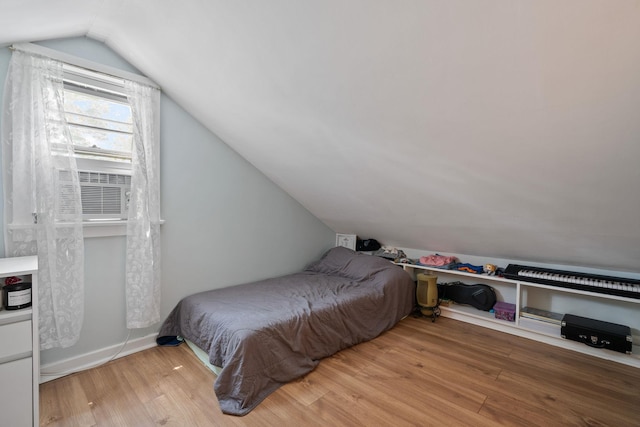 1467 Rte 292, Holmes, NY 12531 - bedroom featuring vaulted ceiling, wood finished floors, and cooling unit