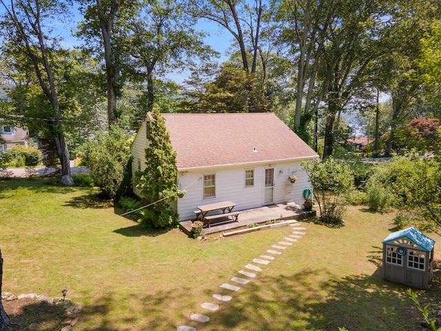 1467 Rte 292, Holmes, NY 12531 - back of house featuring a yard, a patio area, a shed, and roof with shingles