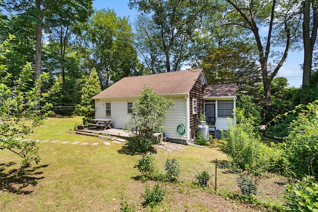 1467 Rte 292, Holmes, NY 12531 - view of home's exterior with a yard, a sunroom, and roof with shingles