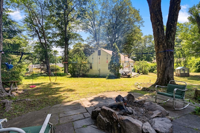1467 Rte 292, Holmes, NY 12531 - view of green lawn with a patio area, a storage unit, and view of scattered trees