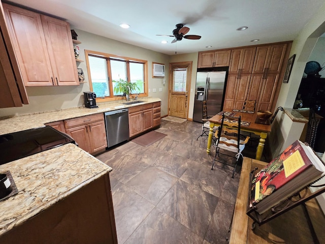 356 Montgomery Ave, West Babylon, NY 11704 - kitchen featuring appliances with stainless steel finishes, a ceiling fan, light stone countertops, and recessed lighting