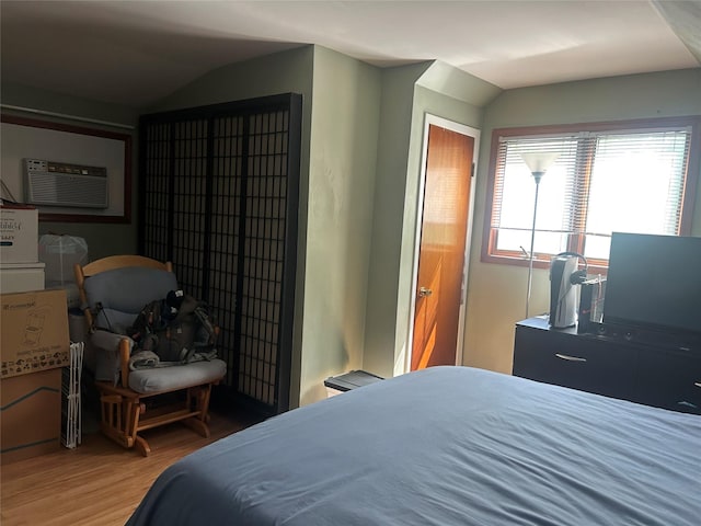 356 Montgomery Ave, West Babylon, NY 11704 - bedroom with vaulted ceiling, light wood-type flooring, and a wall mounted AC