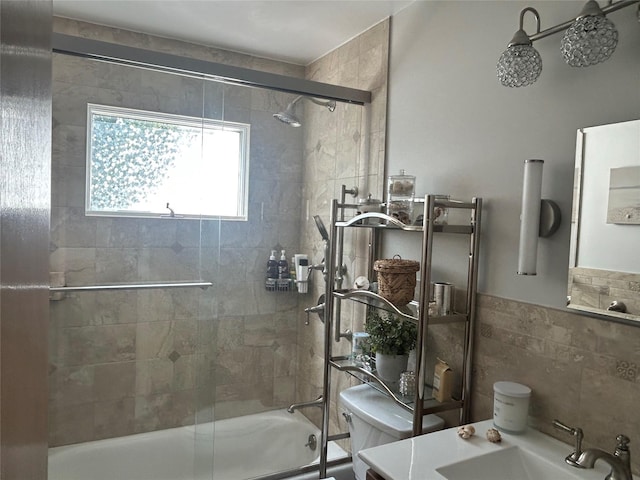 356 Montgomery Ave, West Babylon, NY 11704 - bathroom featuring enclosed tub / shower combo, tile walls, vanity, and a wainscoted wall
