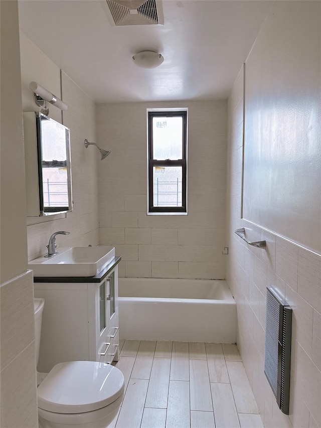 132-30 Sanford Ave Unit 4F, Flushing, NY 11355 - full bathroom with vanity, tile walls, and  shower combination