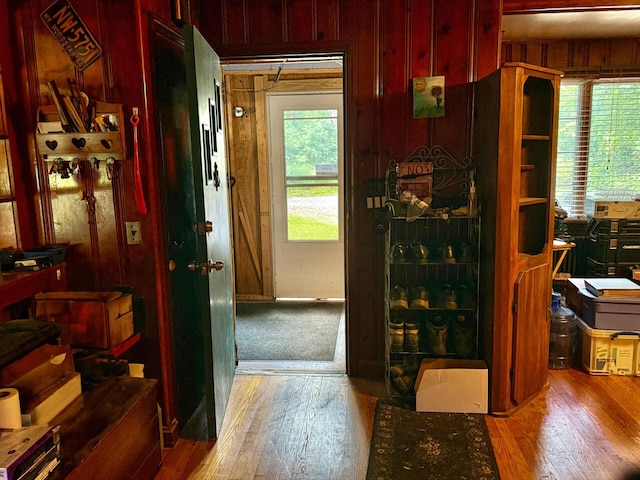 1183 State Route 94, New Windsor, NY 12553 - doorway to outside featuring hardwood / wood-style floors, wooden walls, and plenty of natural light