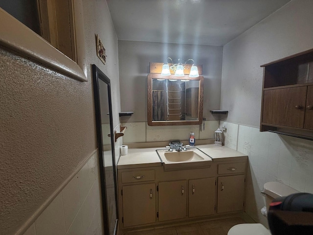 1183 State Route 94, New Windsor, NY 12553 - bathroom featuring vanity, tile walls, and wainscoting