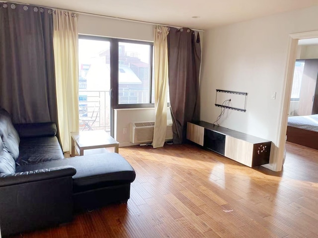 3138 137th St Unit 5A, Flushing, NY 11354 - sitting room featuring light wood-style floors and a wall mounted air conditioner