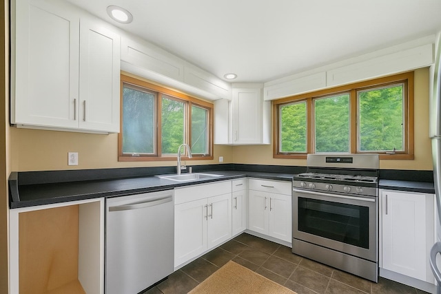 10 May Knl, Dover Plains, NY 12522 - kitchen featuring appliances with stainless steel finishes, dark countertops, plenty of natural light, white cabinetry, and recessed lighting