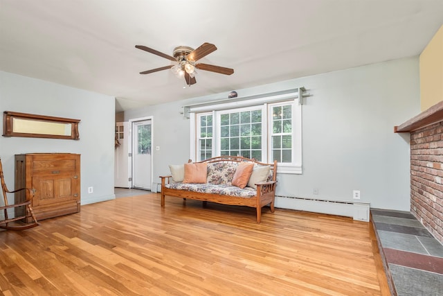 979 Duell Rd, Stanfordville, NY 12581 - sitting room featuring a baseboard heating unit, light wood-style floors, and ceiling fan