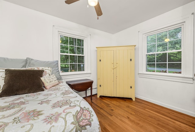 979 Duell Rd, Stanfordville, NY 12581 - bedroom featuring wood finished floors, ceiling fan, and a baseboard heating unit
