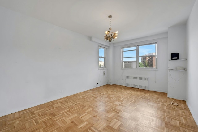 3530 Henry Hudson Pkwy Unit 1B, Bronx, NY 10463 - spare room with radiator heating unit and a chandelier