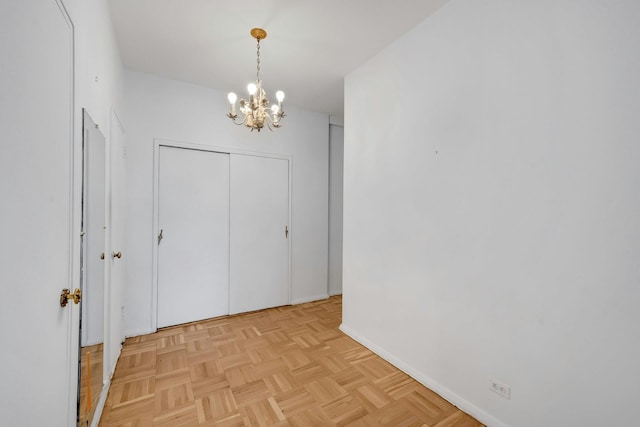 3530 Henry Hudson Pkwy Unit 1B, Bronx, NY 10463 - unfurnished dining area featuring a chandelier and baseboards