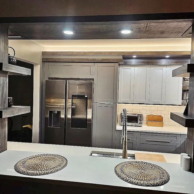 6 Devon Ct, Nanuet, NY 10954 - kitchen featuring refrigerator with ice dispenser, gray cabinetry, light countertops, backsplash, and recessed lighting